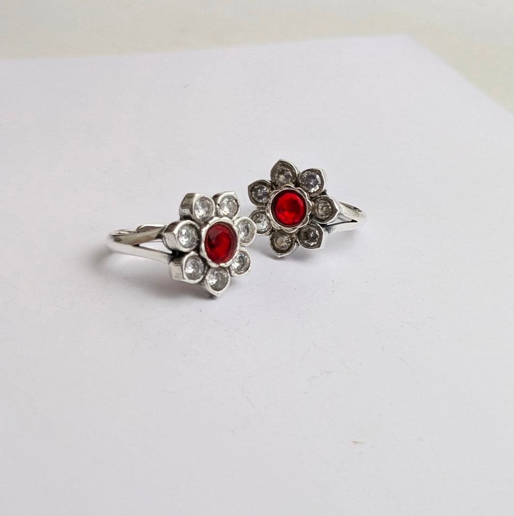 Silver toe ring with red and clear cz